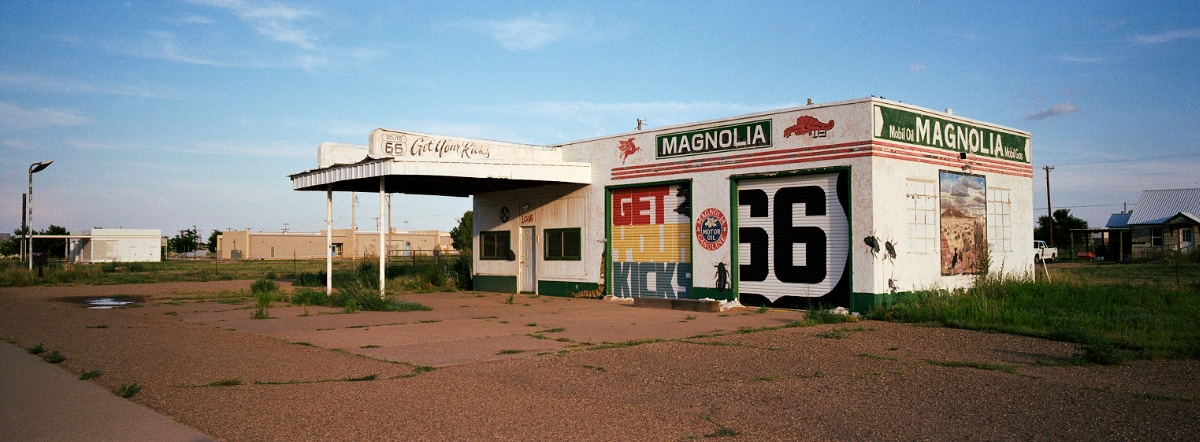 Abandoned building with Route 66 murals in Tucumcari, New Mexico, USA. Taken by Lucas Taylor on a Hasselblad XPan camera.