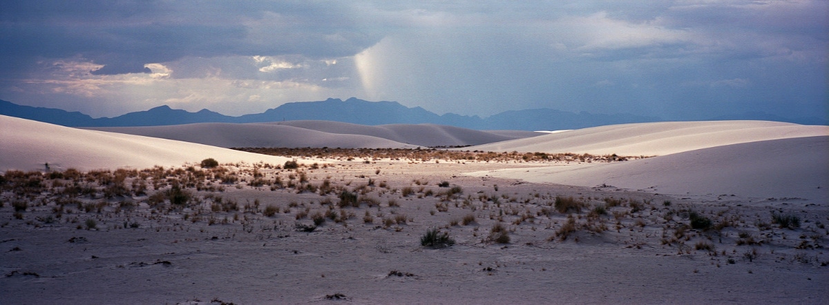 Dramatic lighting over White Sands, New Mexico, USA. Taken by Lucas Taylor on a Hasselblad XPan camera.