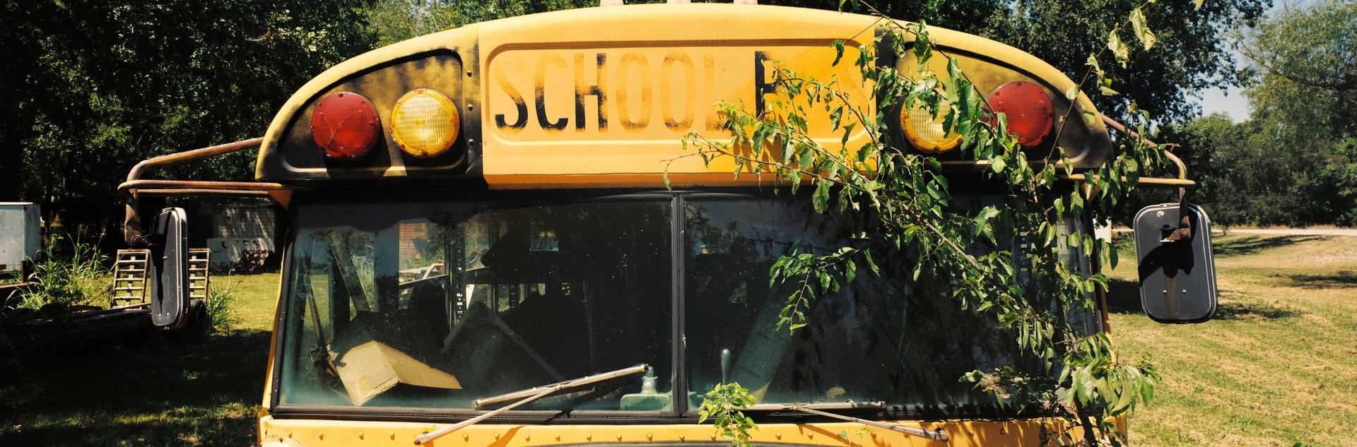 6x17 photograph of an abandoned school bus, taken in Bokchito, Oklahoma, USA. Taken by Lucas Taylor on the ND 6x17 camera.