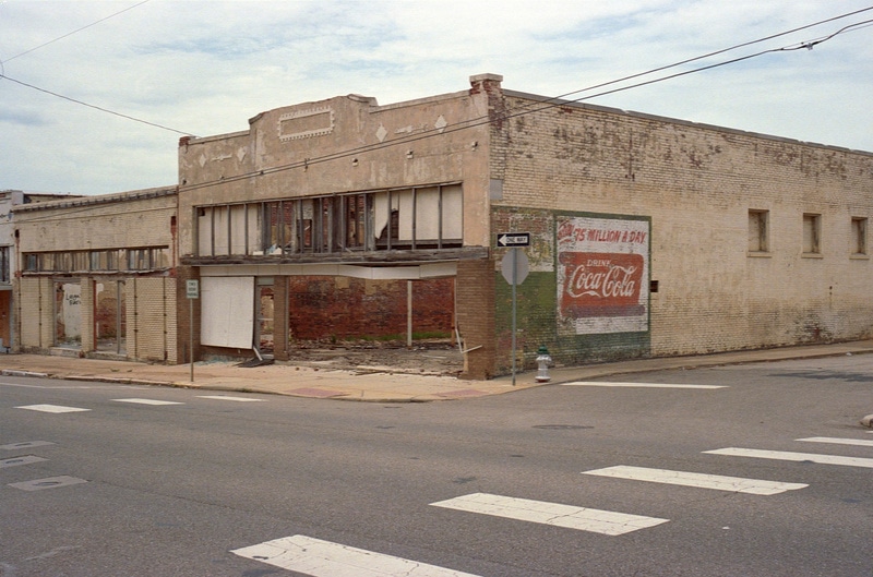 Abandoned building with a Coca-Cola mural in Paris, Texas. Taken by Lucas Taylor on a Hasselblad XPan camera.